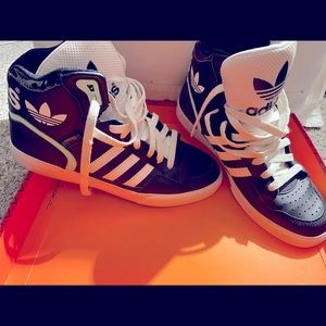 Women’s adidas hi-top sneakers.